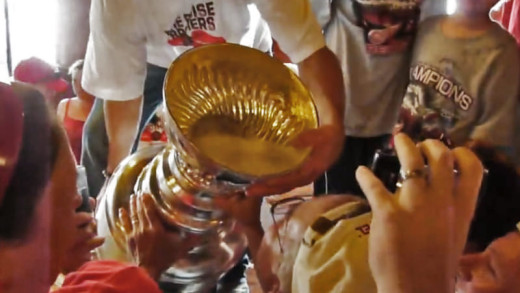 Fans drinking from the Stanley Cup